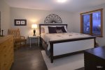 On the first floor is a large guest bedroom with king bed
